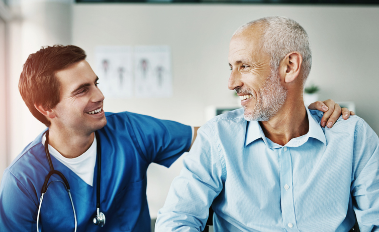 A nurse taking time with a patient.
